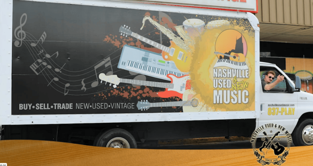 Music truck with instruments and Nashville Used New Music logo.