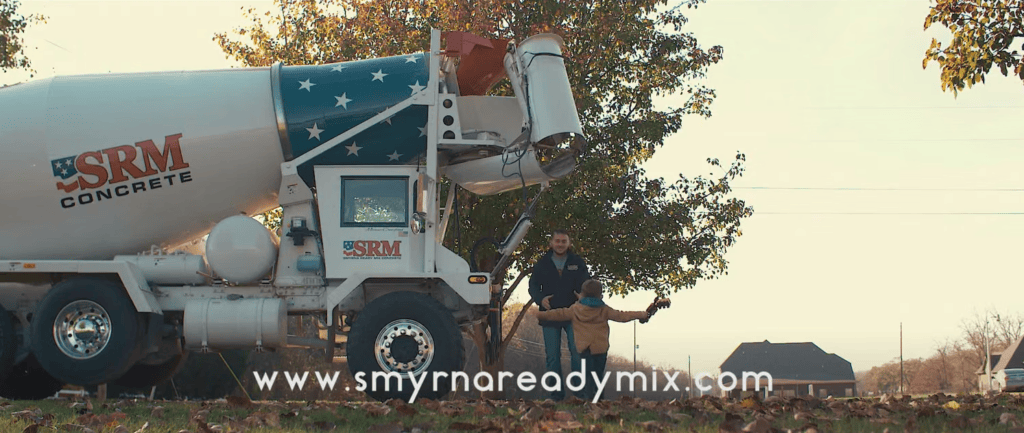 Concrete mixer truck with SRM Concrete logo at Smyrna Ready Mix site.