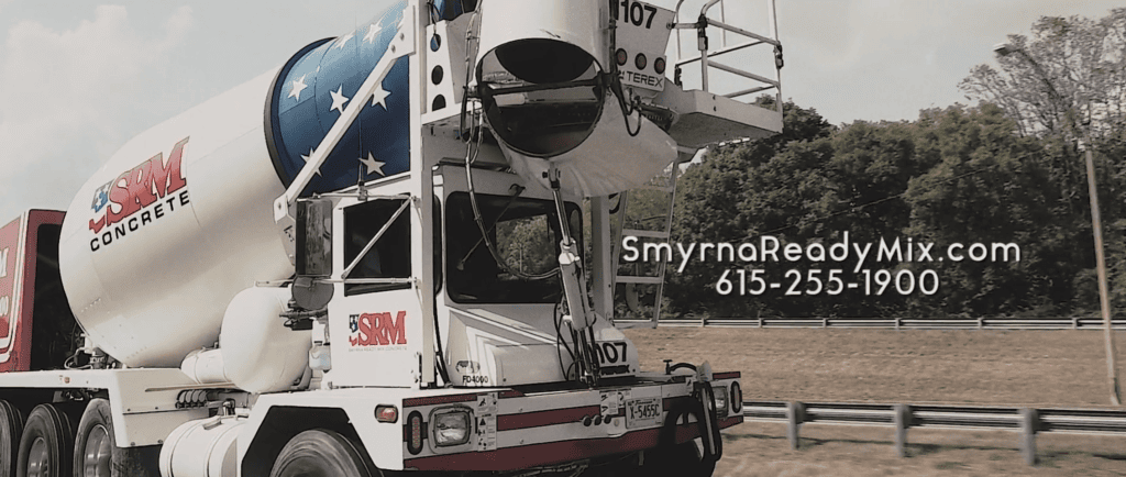 Concrete mixer truck with patriotic design and contact info for SRM Concrete.